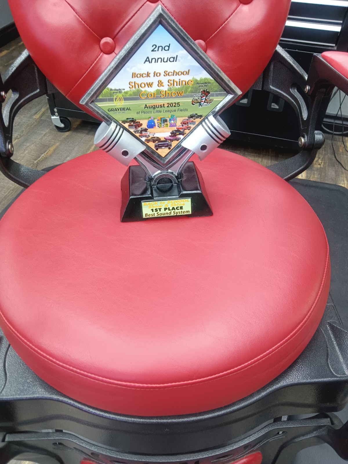 Award trophy on a red barber chair