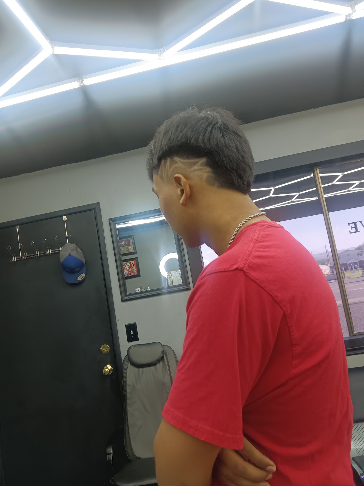 A fresh fade with a hair design at Exclusive Barbershop