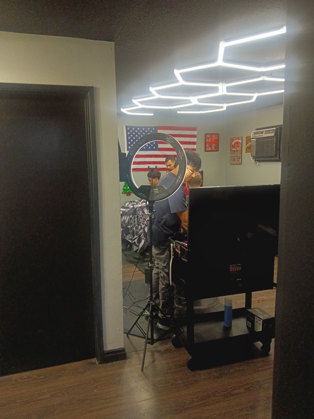 Barbers at work inside Exclusive Barbershop