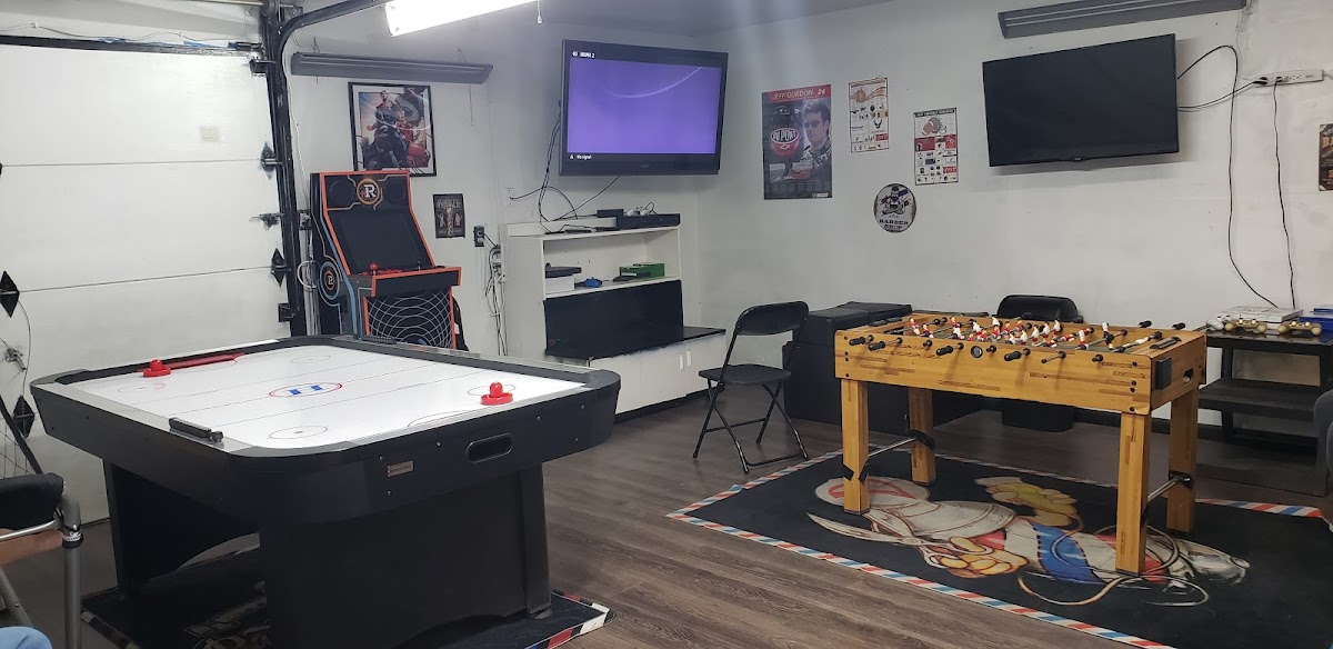 The ManCave at Exclusive Barbershop, air hockey, foosball and arcade